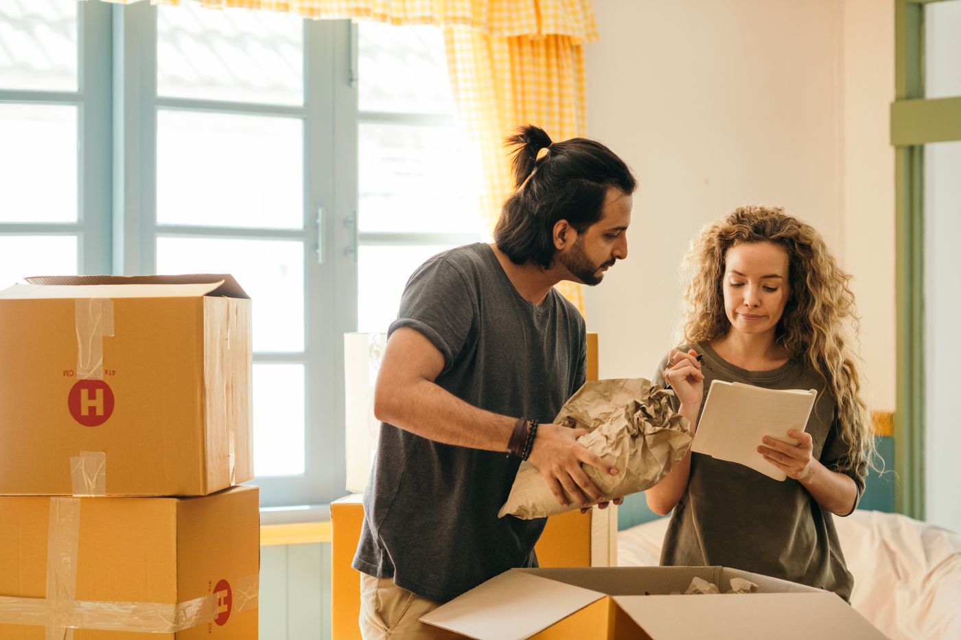 A couple moving into a new London flat
